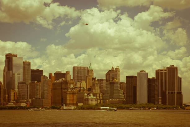 New York Skyline featuring the new World Trade Centre viewed from Hudson Bay at Sunrise.