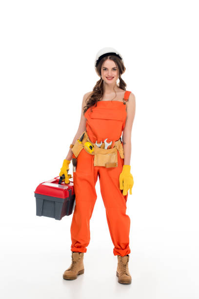 istock beautiful workwoman in uniform holding toolbox, isolated on white 916134476
