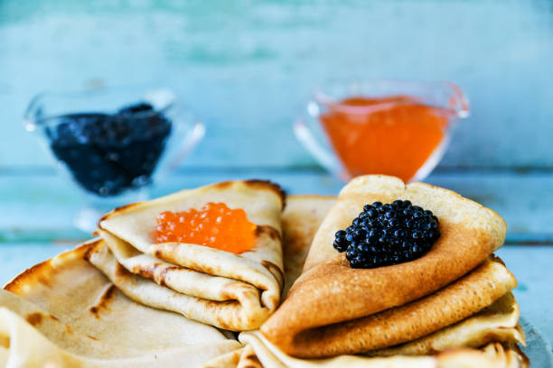 istock Russian Maslenitsa, pancakes with red and black caviar 916134870