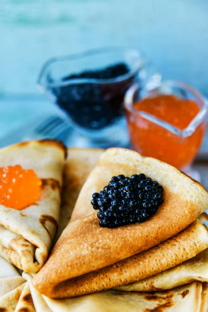 istock Russian Maslenitsa, pancakes with red and black caviar 916134946