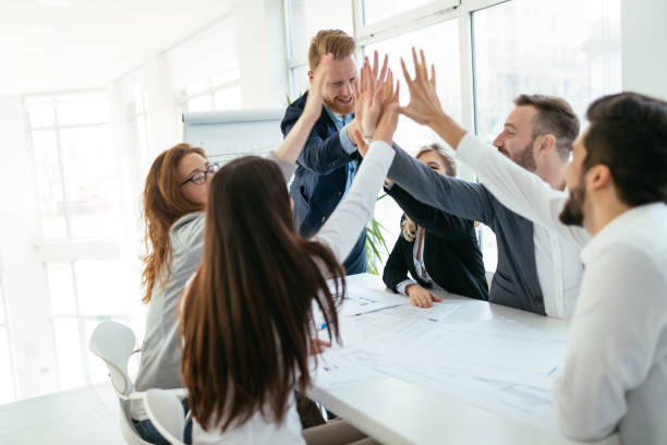 istock Happy business people celebrating success 916142288