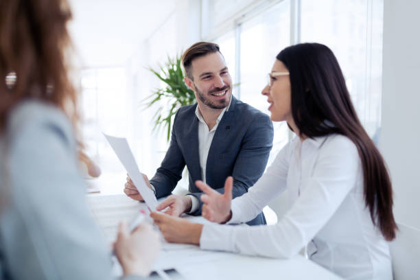 istock Happy colleagues casual chat at the office 916144758