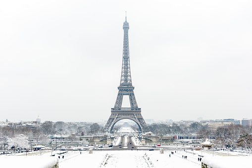 The Eiffel tower by a rare snowy day in Paris seen from the Trocadero Esplanade.