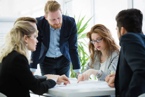 istock Business colleagues collaborating and discussing project plans 916145018