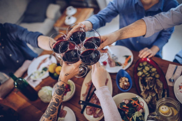istock People making toast with wine glasses 916145266