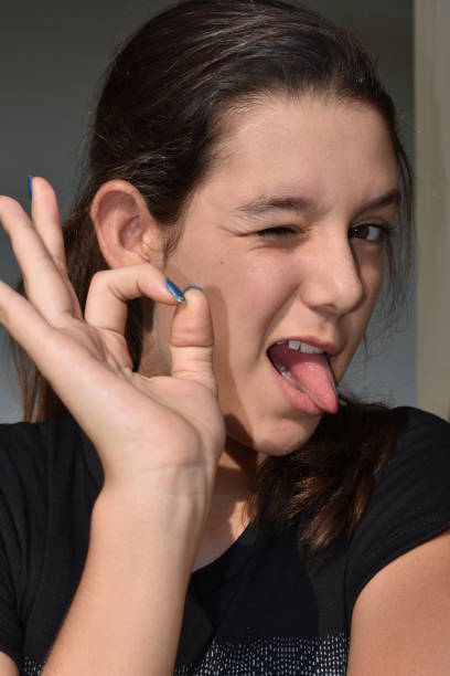 istock Latina Female Making Funny Faces 916145768