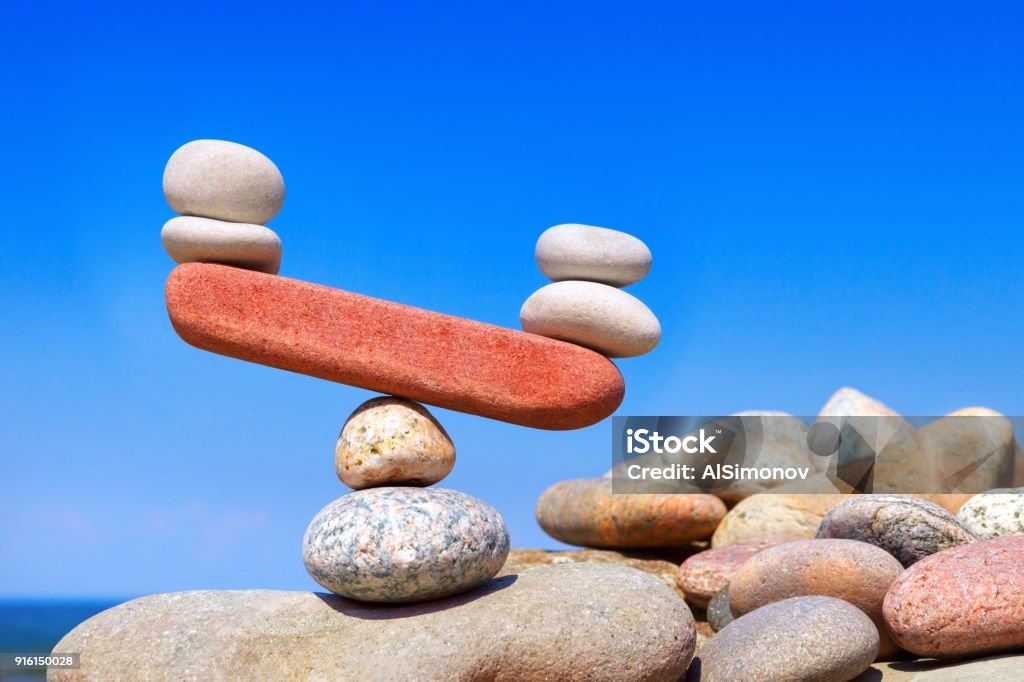 Symbolic scales from stones. The disturbed equilibrium. Imbalance concept. Symbolic scales from stones. The disturbed equilibrium. Imbalance concept Imbalance Stock Photo