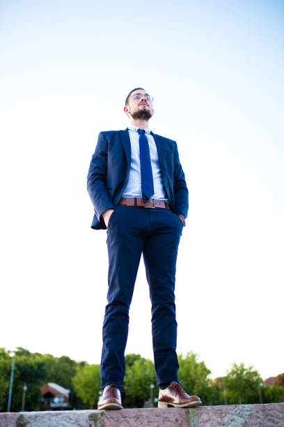 istock Handsome businessman in trendy suit posing 916151690