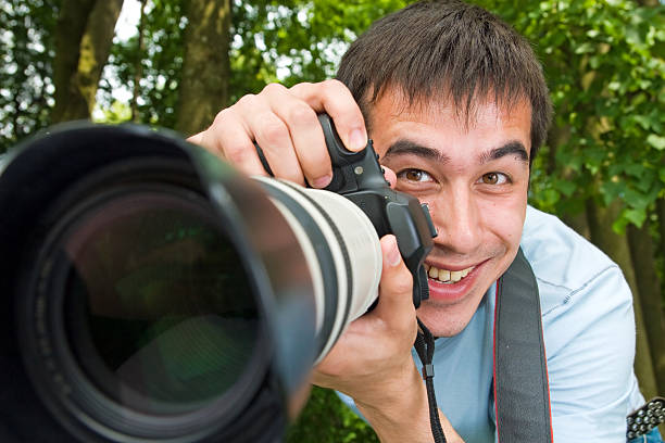 istock The cheerful photographer 91615591