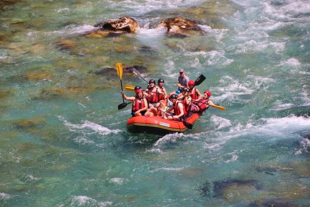 White water rafting on the Tara river, Montenegro and Bosnia and Herzegovina. Tara river, Montenegro - July 9, 2017: White water rafting on the Tara river. In Northeast Montenegro, near the border to Bosnia and Herzegovina. Southeast Europe. durmitor national park photos stock pictures, royalty-free photos & images