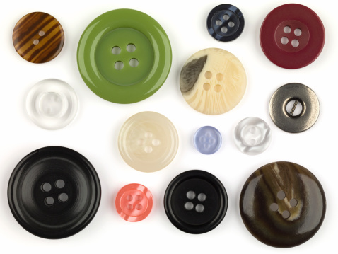 A collection of assorted colorful buttons of varying sizes with precise clipping paths 