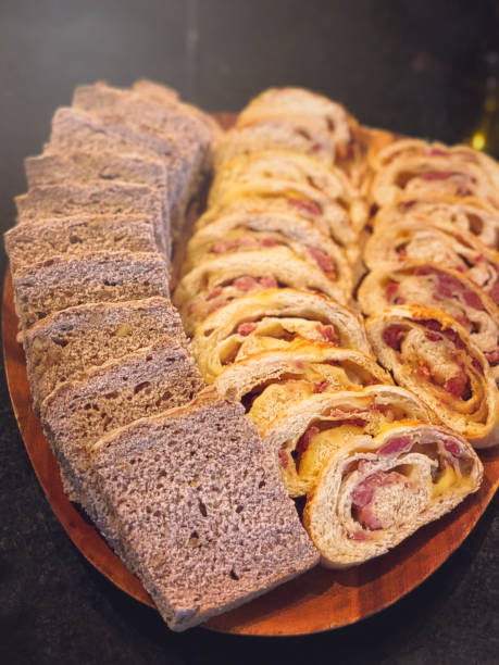 istock Cut breads ready to eat served on wooden board. 916159754