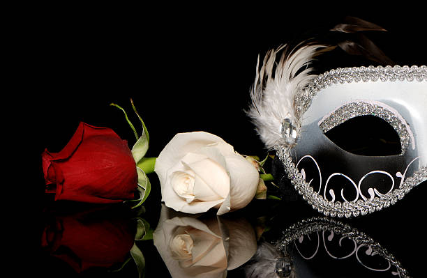 The Venetian mask and flowers on a black background stock photo
