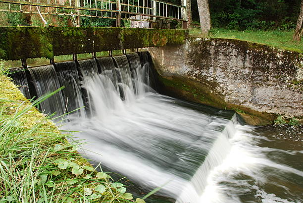 istock Beautiful waterfall near old watermill 91616206