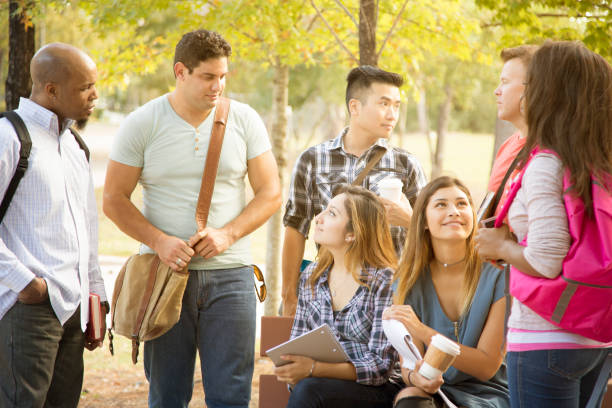 istock College student friends talk together on university campus. 916163542