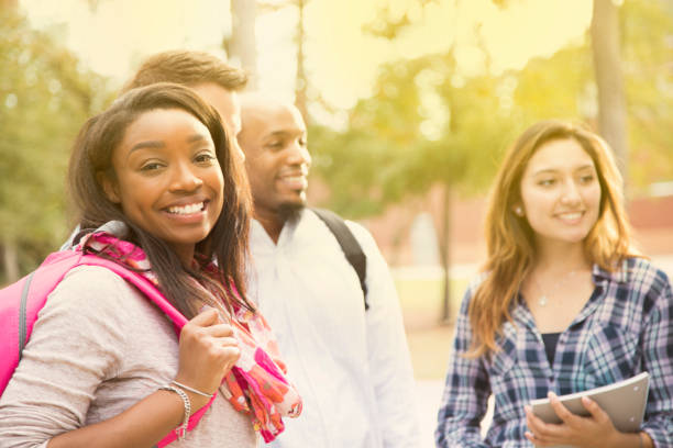 istock College student friends talk together on university campus. 916163708