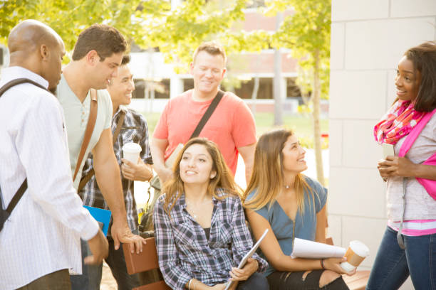 istock College student friends talk together on university campus. 916167420