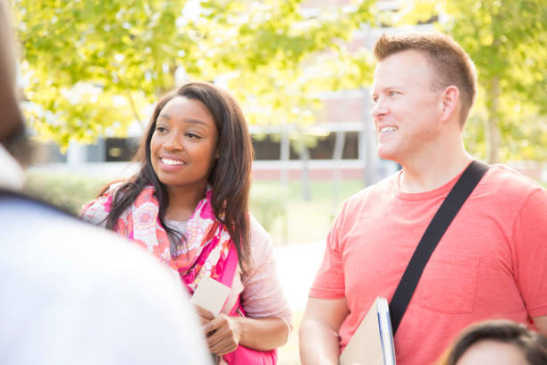 istock College student friends talk together on university campus. 916167622