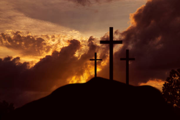 istock Easter, Crucifixion scene with three cross on hill. 916167712