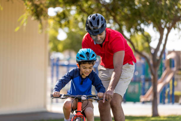 istock Father and Son Bicycle Riding 916168278