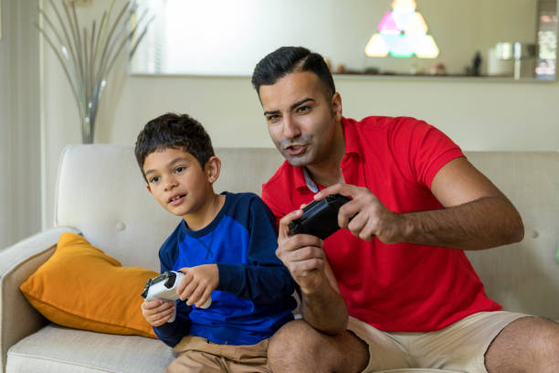 istock Father and Son Playing Video Games 916170696