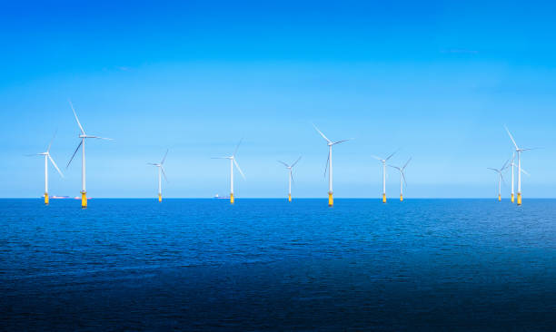 istock Offshore Wind Turbine in a Wind farm under construction off the England coast. 916171400