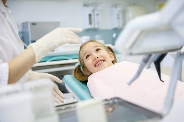 istock Little girl at dentist office 916180280