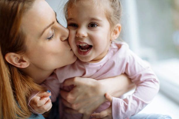 istock Mother kiss 916184632