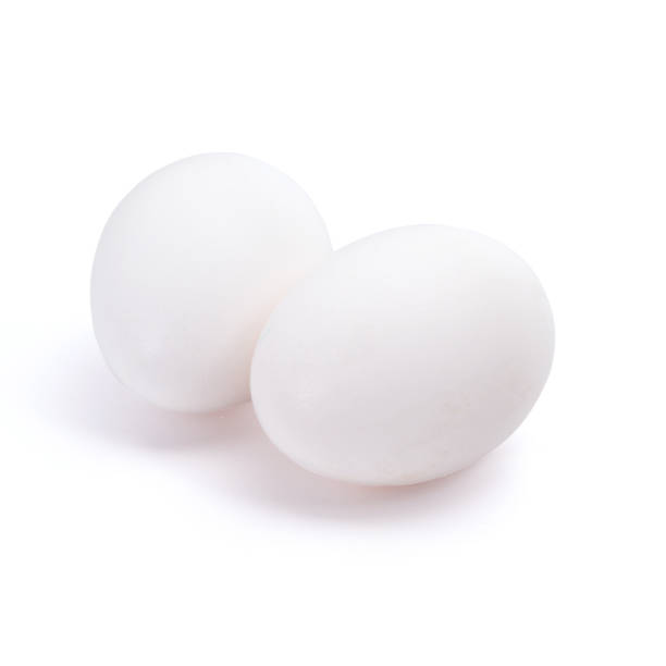 istock Group of two white eggs isolated on white background 916185016