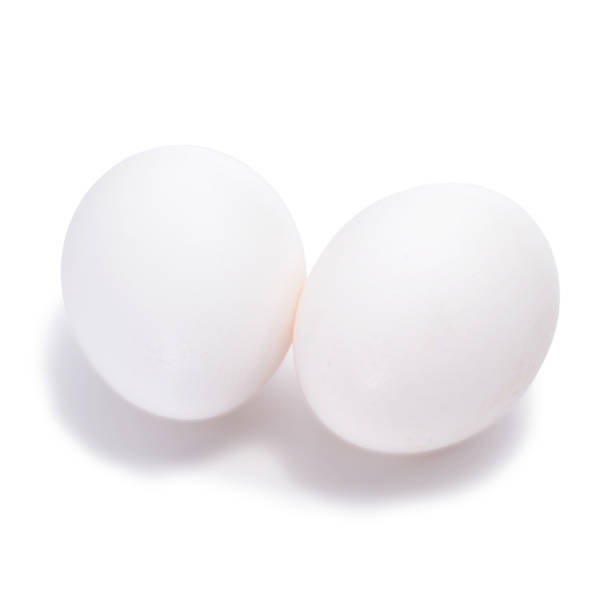 istock Group of two white eggs isolated on white background 916185022