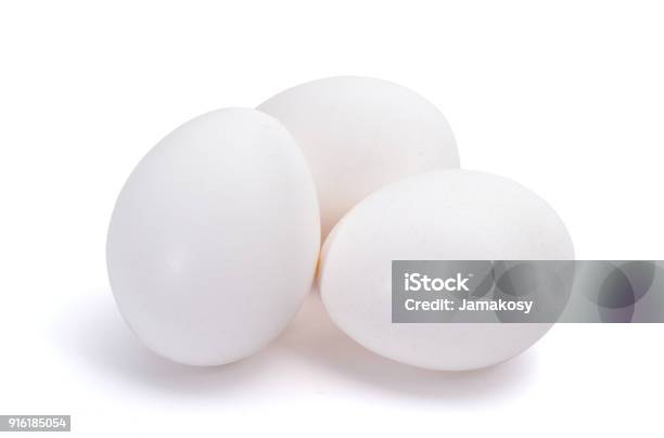 Group Of Three White Eggs Isolated On White Background Stock Photo - Download Image Now