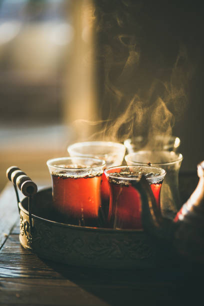 istock Traditional hot steaming Turkish tea in tulip glasses 916185100