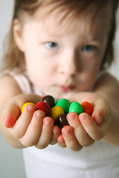 istock Small girl the hands candies 91618517