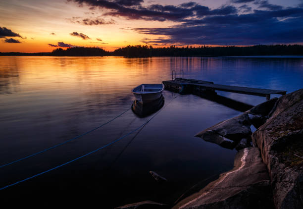 istock Boat at jetty at sunset 916185220
