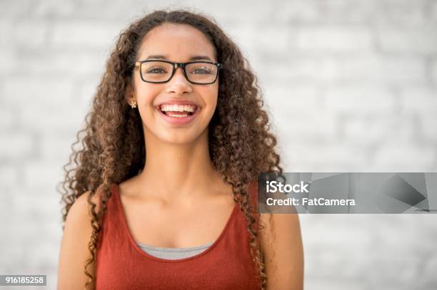 Happy Girl Wearing Glasses Stock Photo - Download Image Now - Teenage Girls, Teenager, 14-15 Years