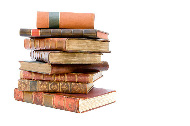 Pile of old leather bound books stock photo