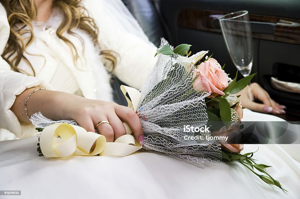 Ring, hands and  flowers of the bride  Rose - Flower Stock Photo