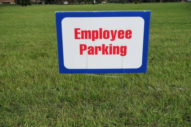 istock Sign in grass indicating Employee Parking 916191728