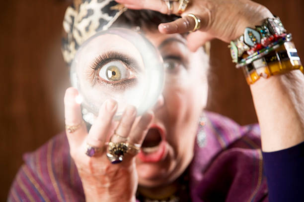 The psychic woman with white hair holding a crystal ball. Retro neon lights in the background.