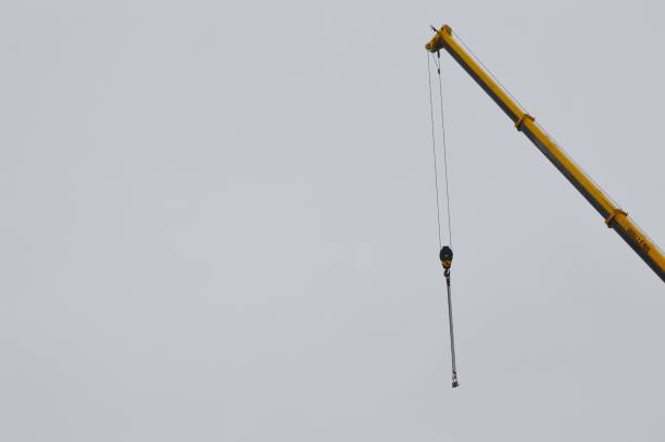 istock Building crane against cloudy sky 916197426
