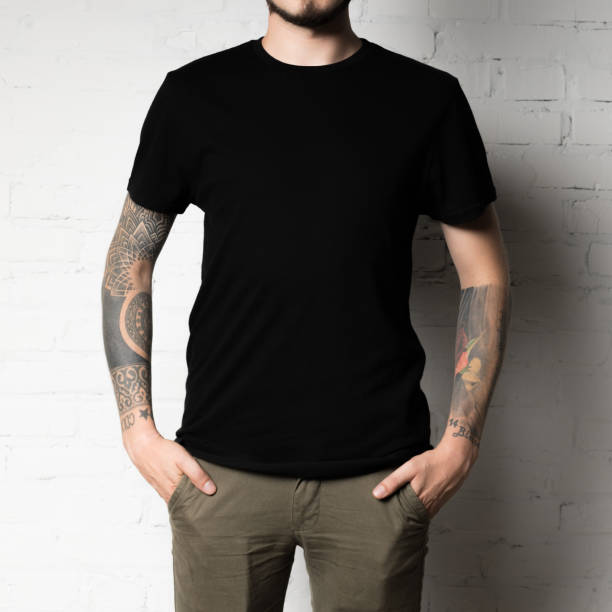 man in blank black t-shirt cropped shot of man in blank black t-shirt black tattoo stock pictures, royalty-free photos & images