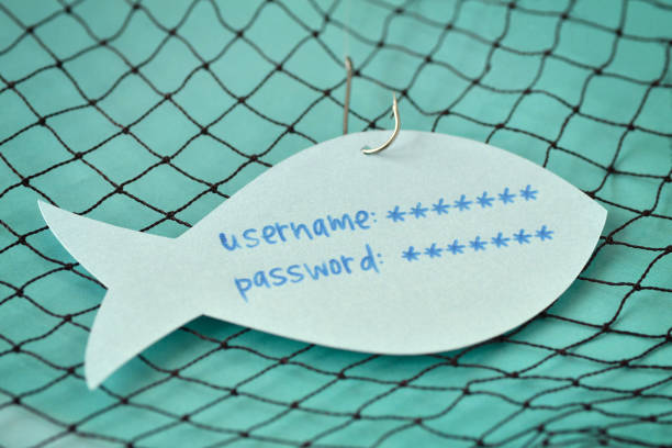 benutzername und passwort auf einem papier-schuldbrief in der form eines fisches geschrieben befestigt an einem haken - phishing und internet security-konzept - phishing fotos stock-fotos und bilder