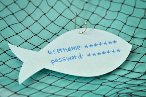 nome utente e password scritti su una nota cartacea a forma di pesce attaccato a un gancio - concetto di phishing e sicurezza internet - fishing worm foto e immagini stock