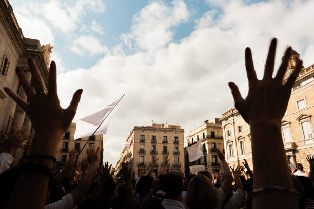 istock people demonstrating with hands up and flags 916200534