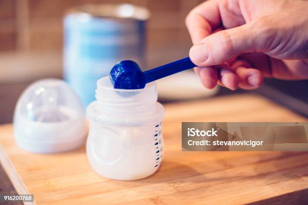 Father Making Baby Formula In Milk Bottle Stock Photo - Download Image Now - Infant Formula, Ground - Culinary, Baby Bottle