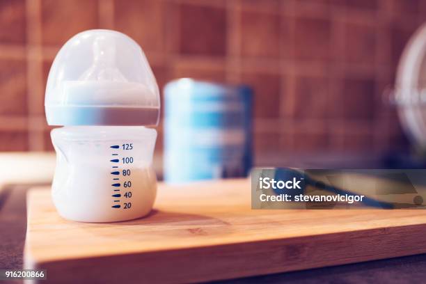 Baby Formula In Milk Bottle Stock Photo - Download Image Now - Baby Bottle, Milk, Infant Formula