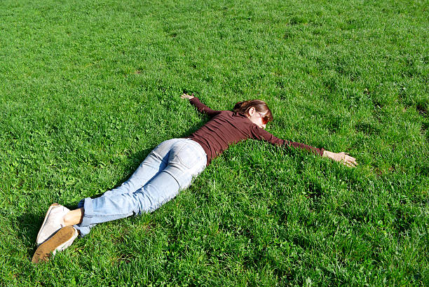 Calm Girl on grass. Element of design. face down stock pictures, royalty-free photos & images