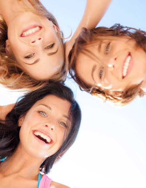 istock girls faces with shades looking down 916208262