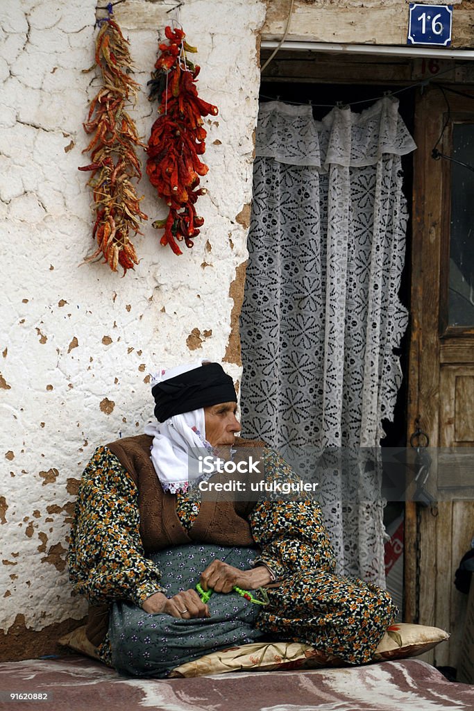 old woman in front of house  70-79 Years Stock Photo