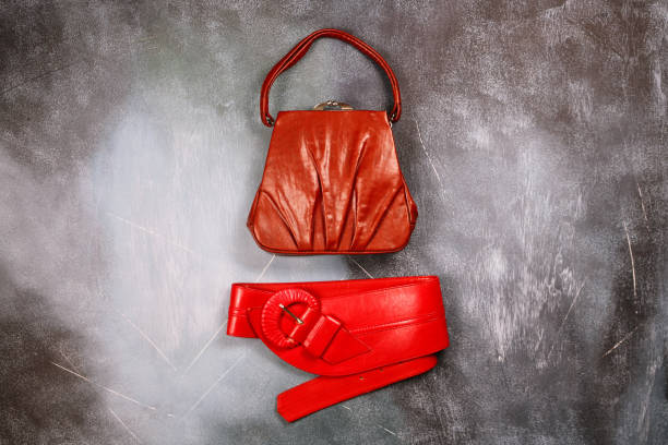 istock Red leather handbag and belt, retro styled 916212304